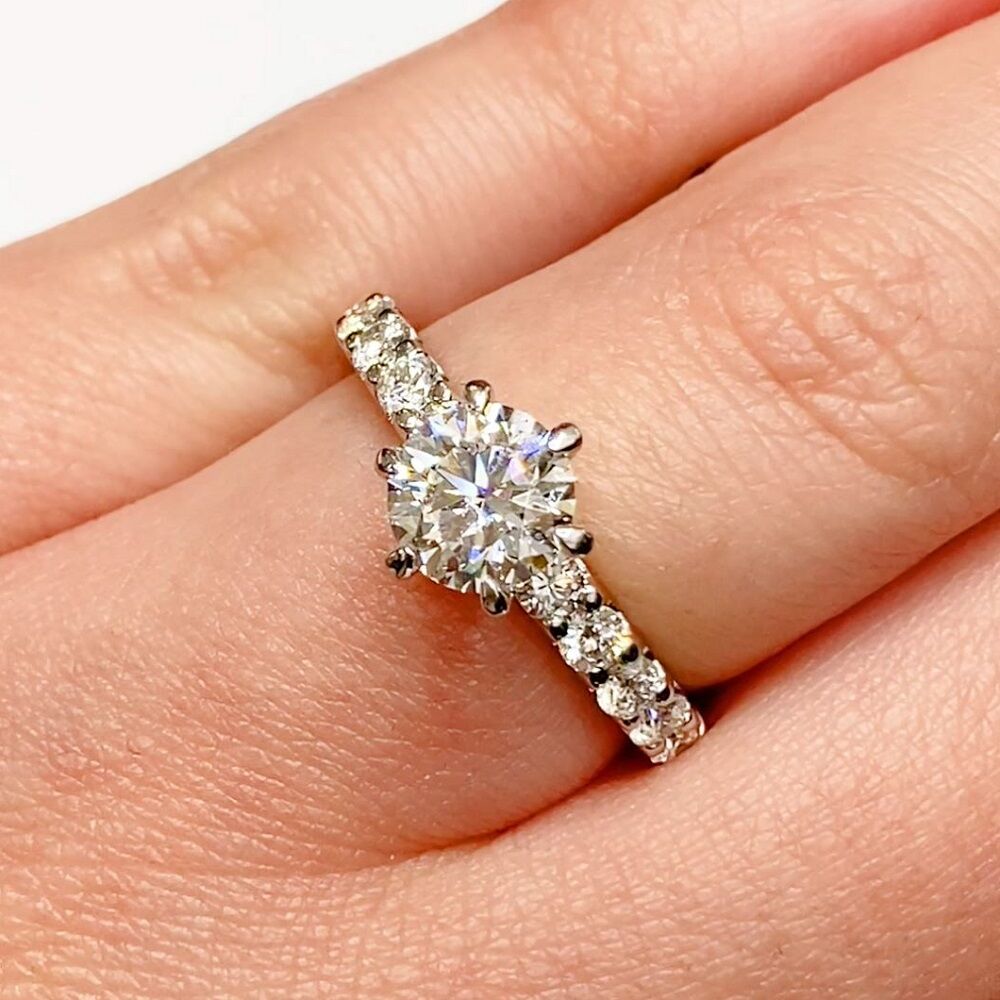 Brilliant cut solitaire & diamond band ring