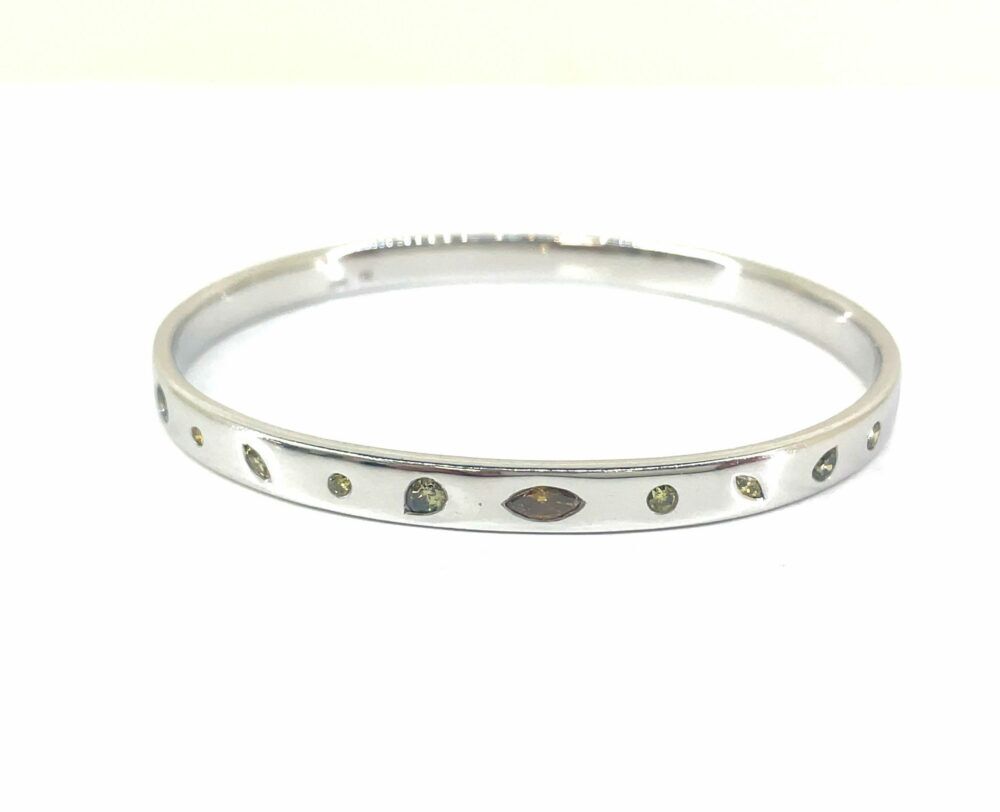 White gold bangle with fancy coloured diamonds.